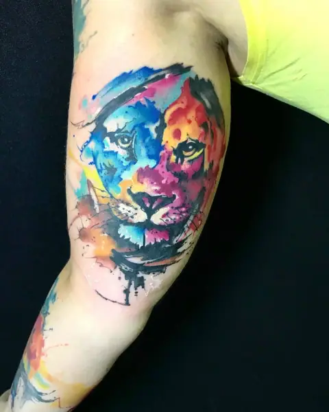 Abstract watercolor lion face tattoo by Neto, Boca Raton