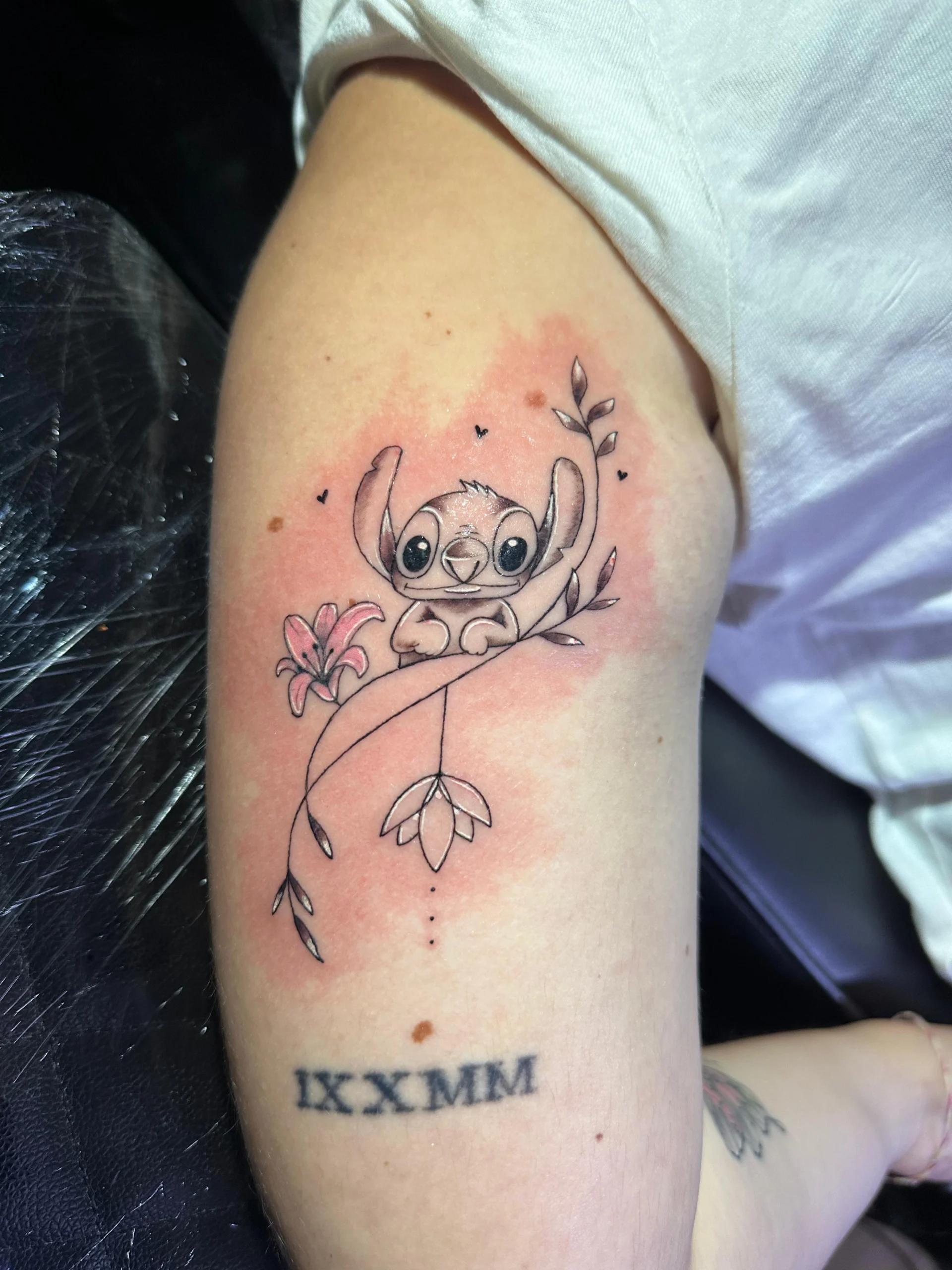 Disney Stitch holding lily flower tattoo watercolor background Boca Raton FL