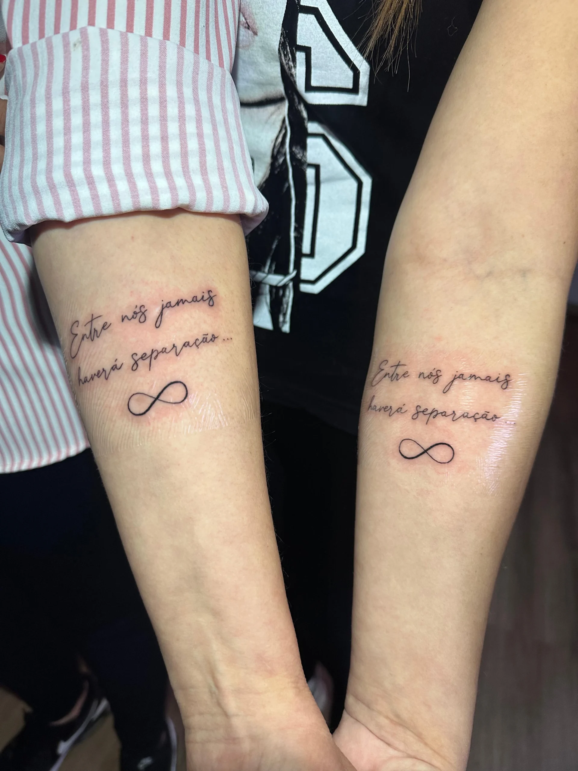 Matching infinity tattoos with Portuguese quote friendship ink Boca Raton