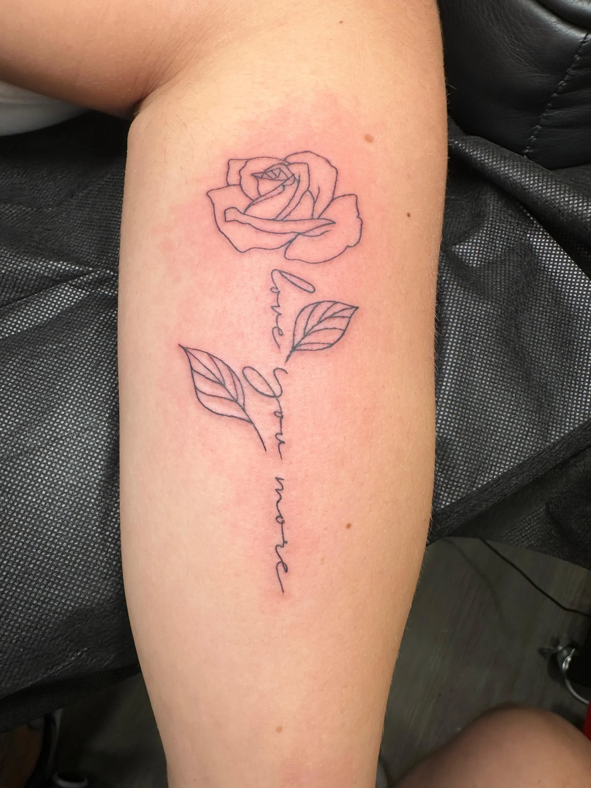 Rose outline tattoo with love you more script stem fine line arm Boca Raton