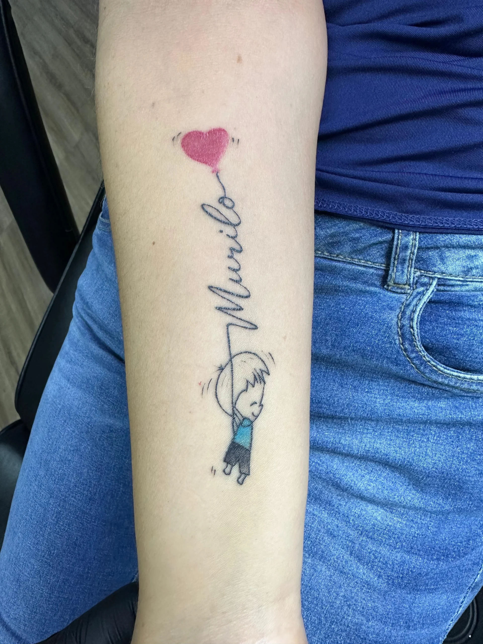 Sketch style boy with heart balloon tattoo child name tribute forearm Boca Raton