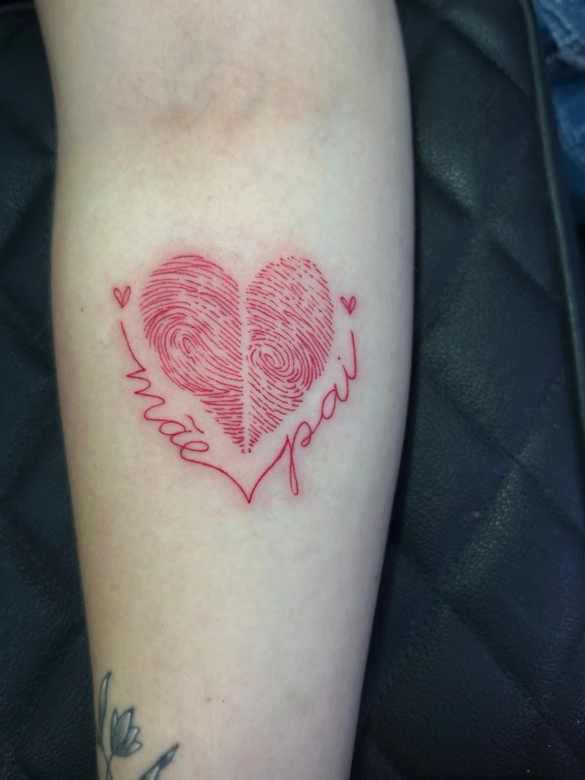 Red fingerprint heart tattoo with mom and dad script memorial ink Boca Raton