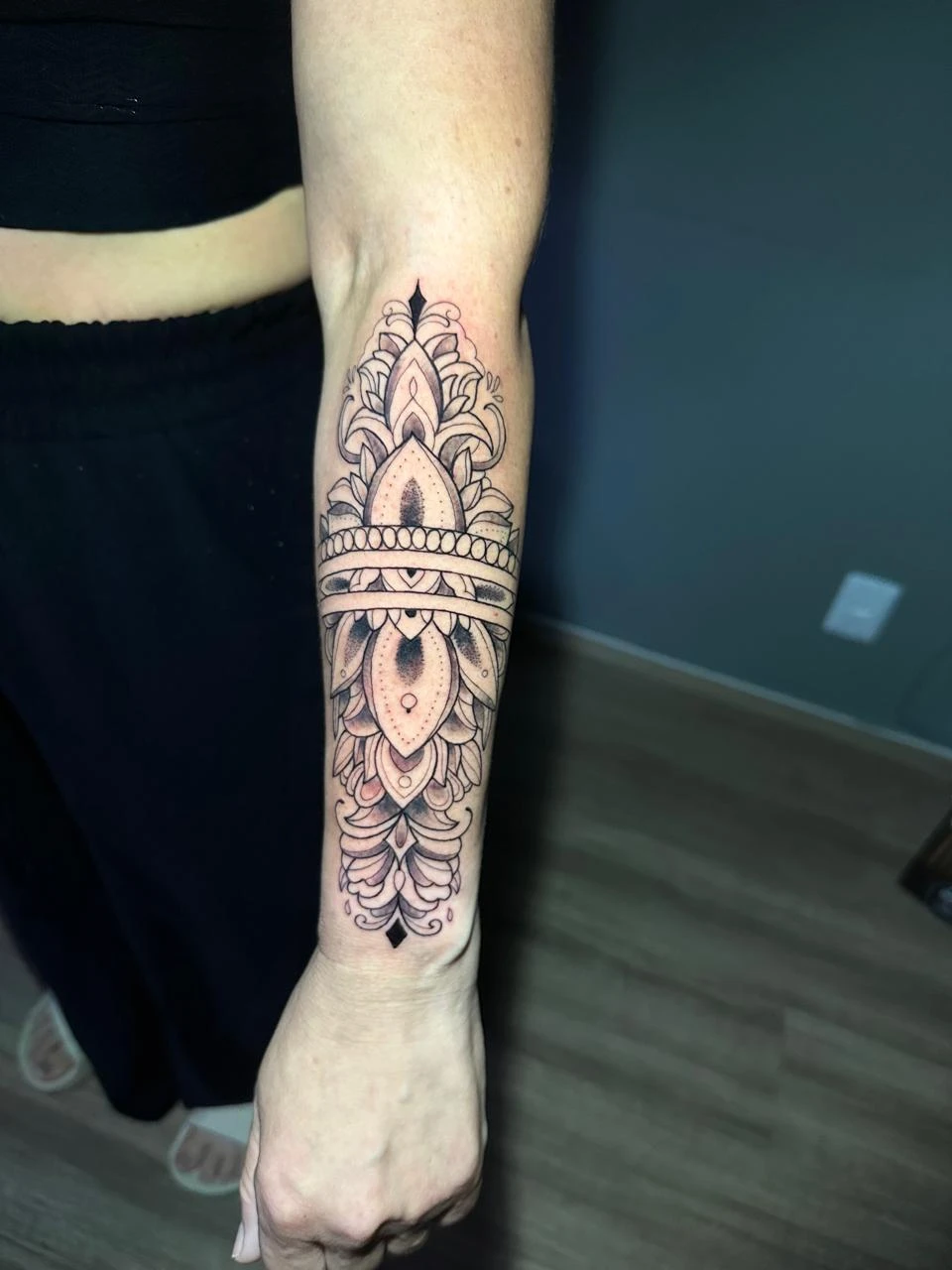 Geometric ornamental forearm tattoo with mandala and dotwork styling Boca Raton FL