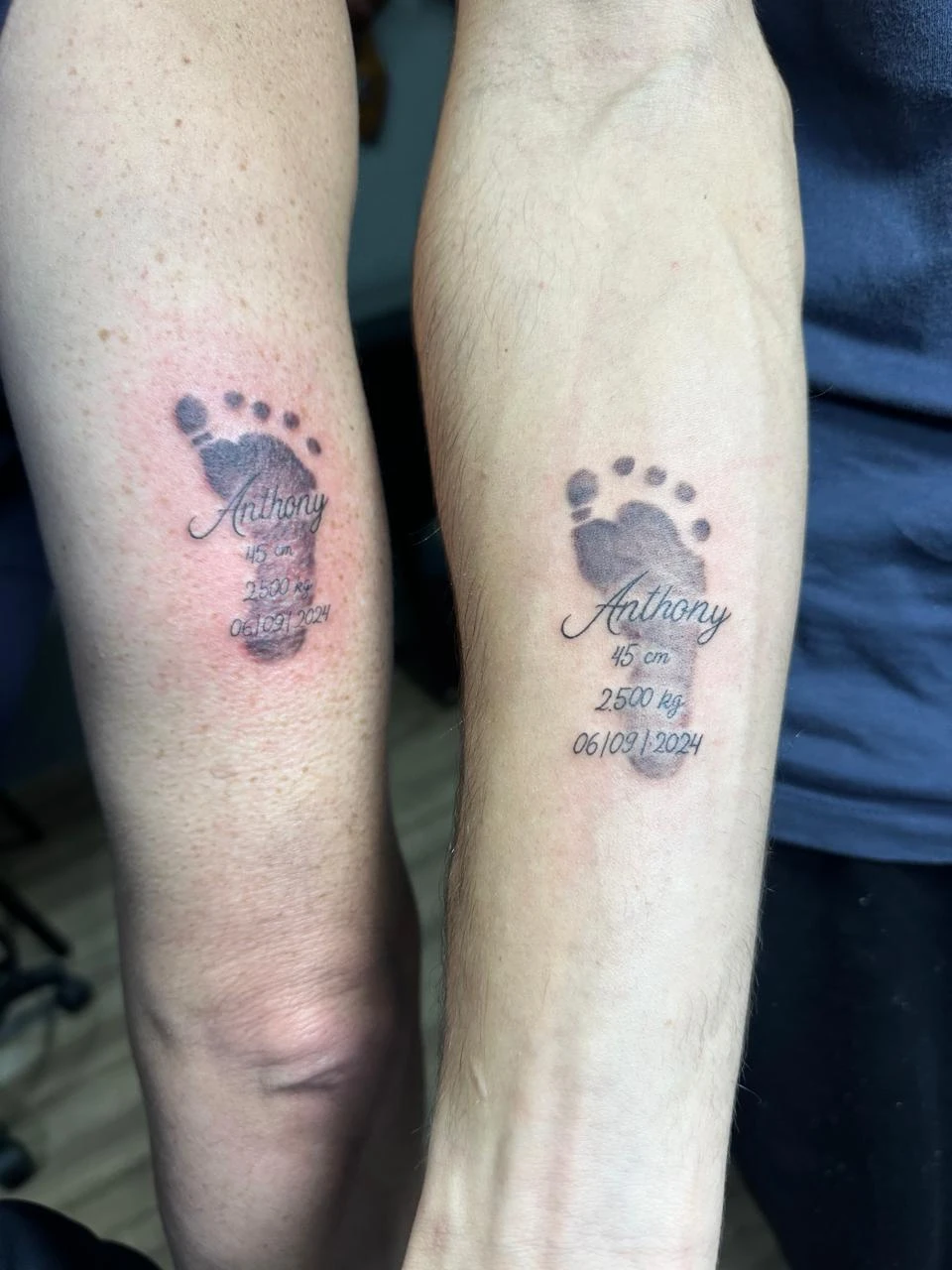 Realistic baby footprint tattoo with birth stats matching parents ink Boca Raton FL