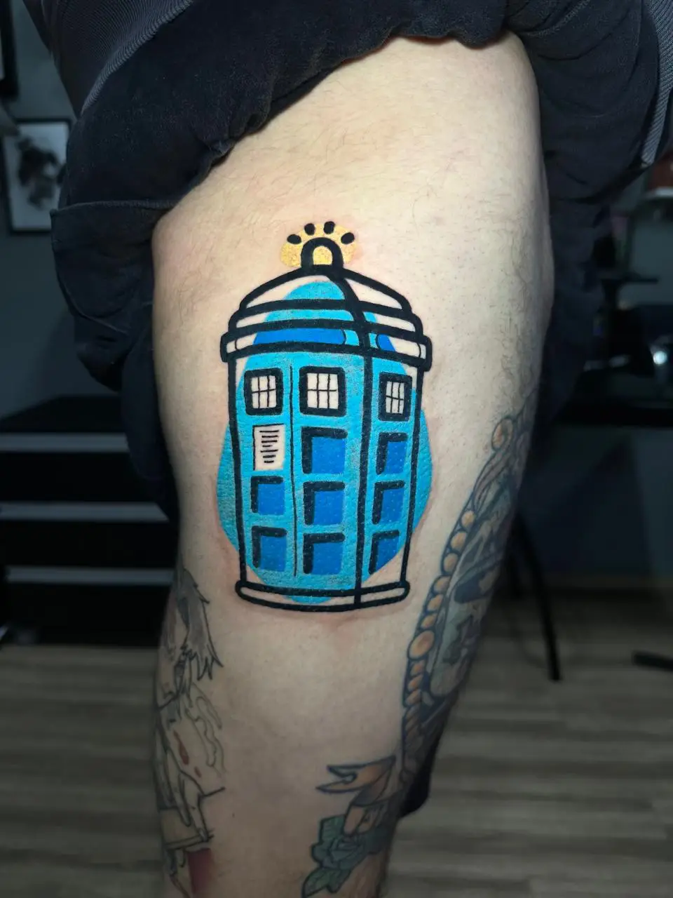 Traditional style TARDIS tattoo from Doctor Who, bold blue sci-fi ink for geeks and fans in Boca Raton, Florida.