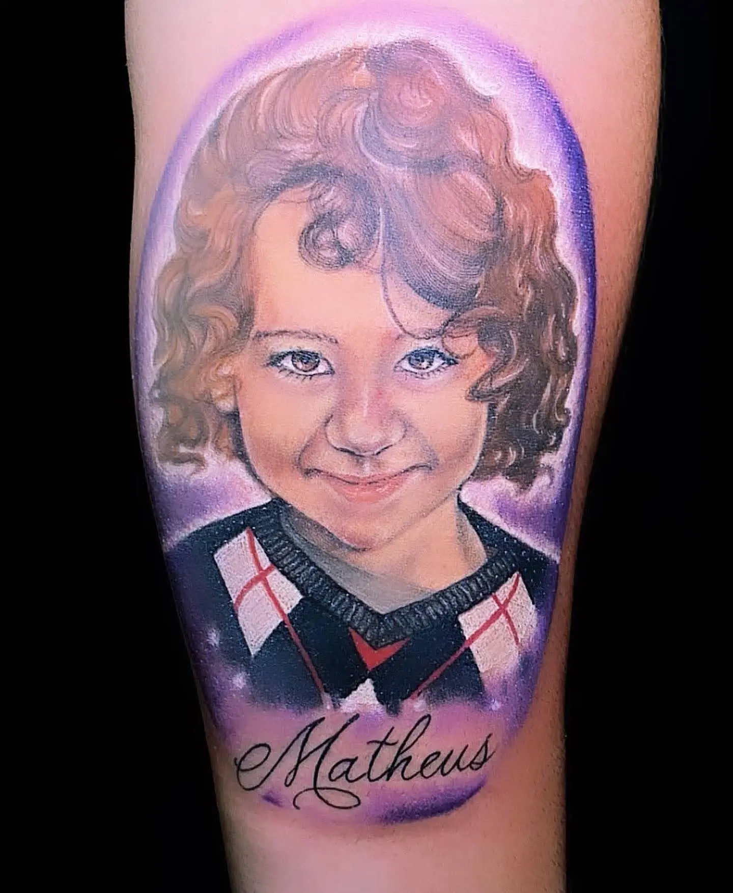 Hyper-realistic color portrait tattoo of a smiling young boy named Matheus, expert memorial and family ink in Boca Raton, Florida.