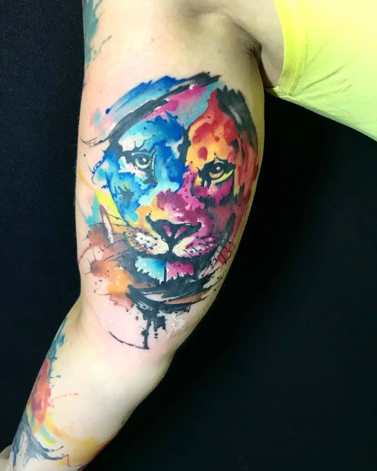 Abstract watercolor lion face tattoo blue and red artistic animal ink South Florida Boca Raton