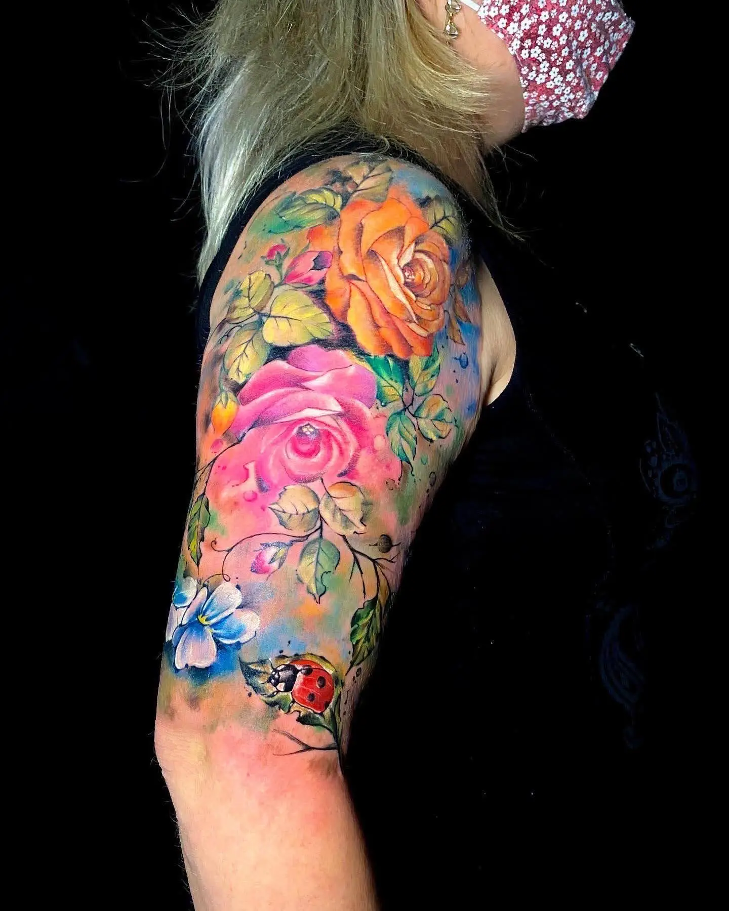 Watercolor floral half sleeve tattoo orange and pink roses arm ink Boca Raton shop