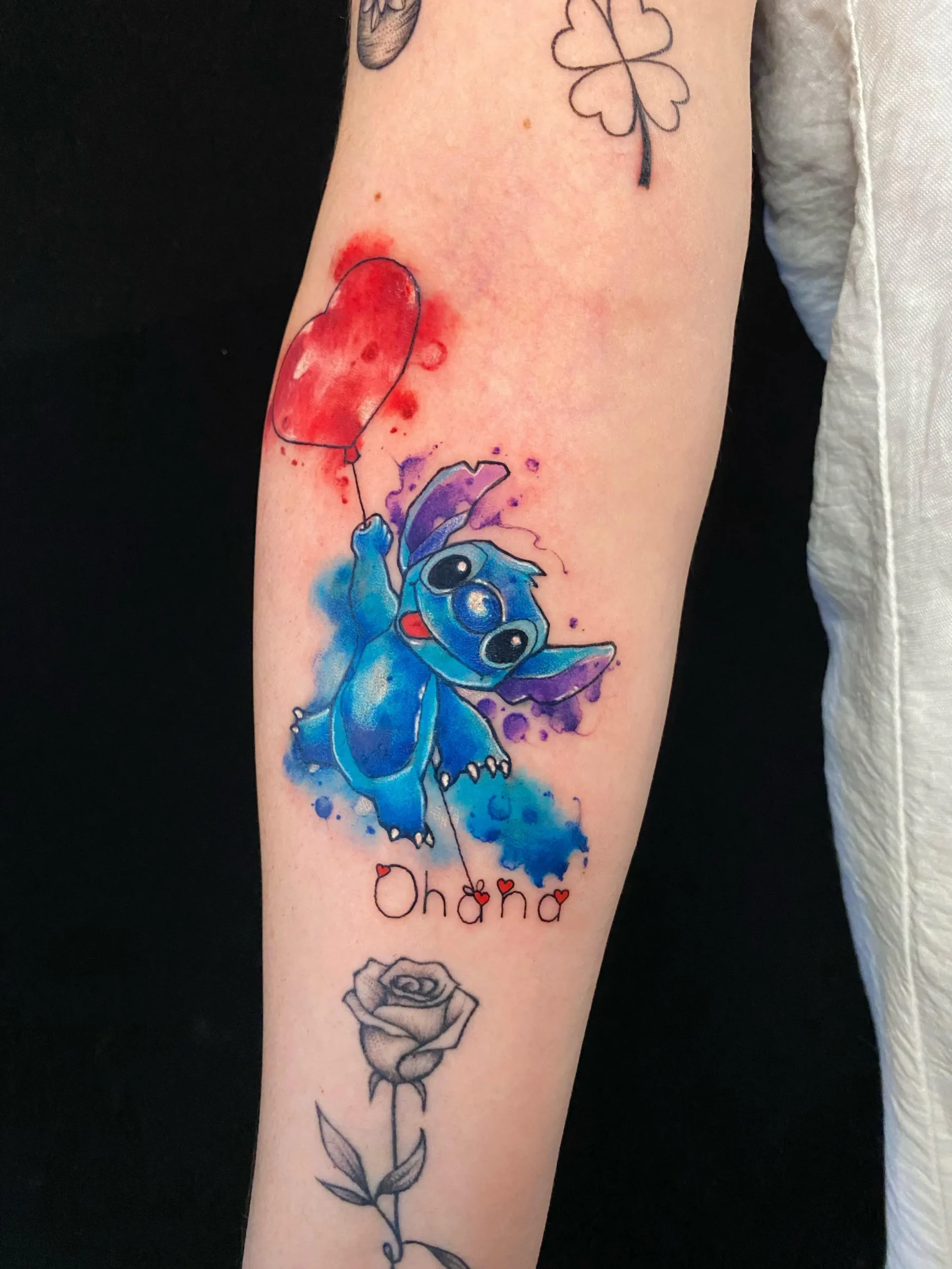 Disney Stitch watercolor tattoo holding heart balloon Ohana script Boca Raton Florida