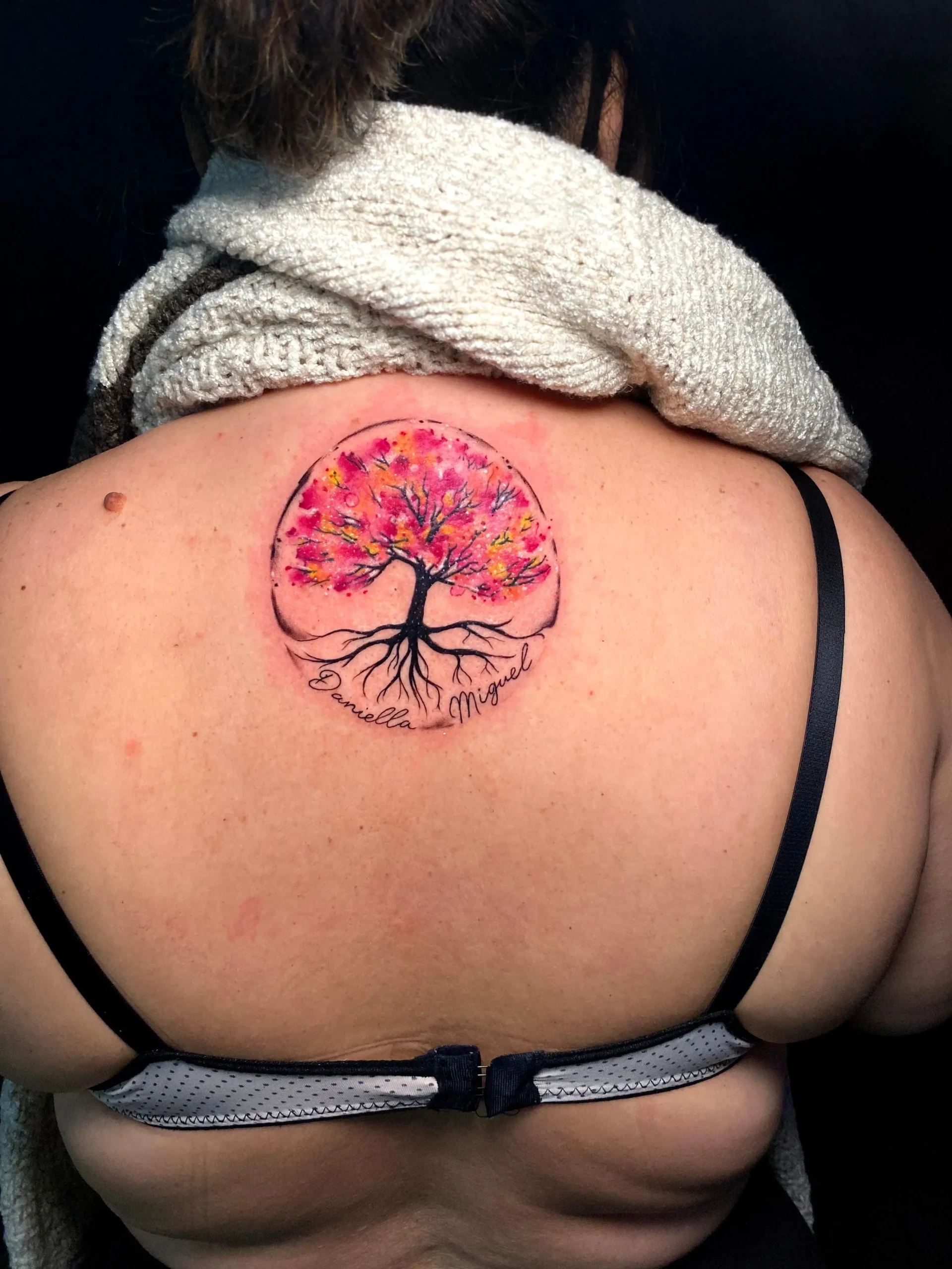Round watercolor tree of life tattoo with family names upper back ink Boca Raton studio