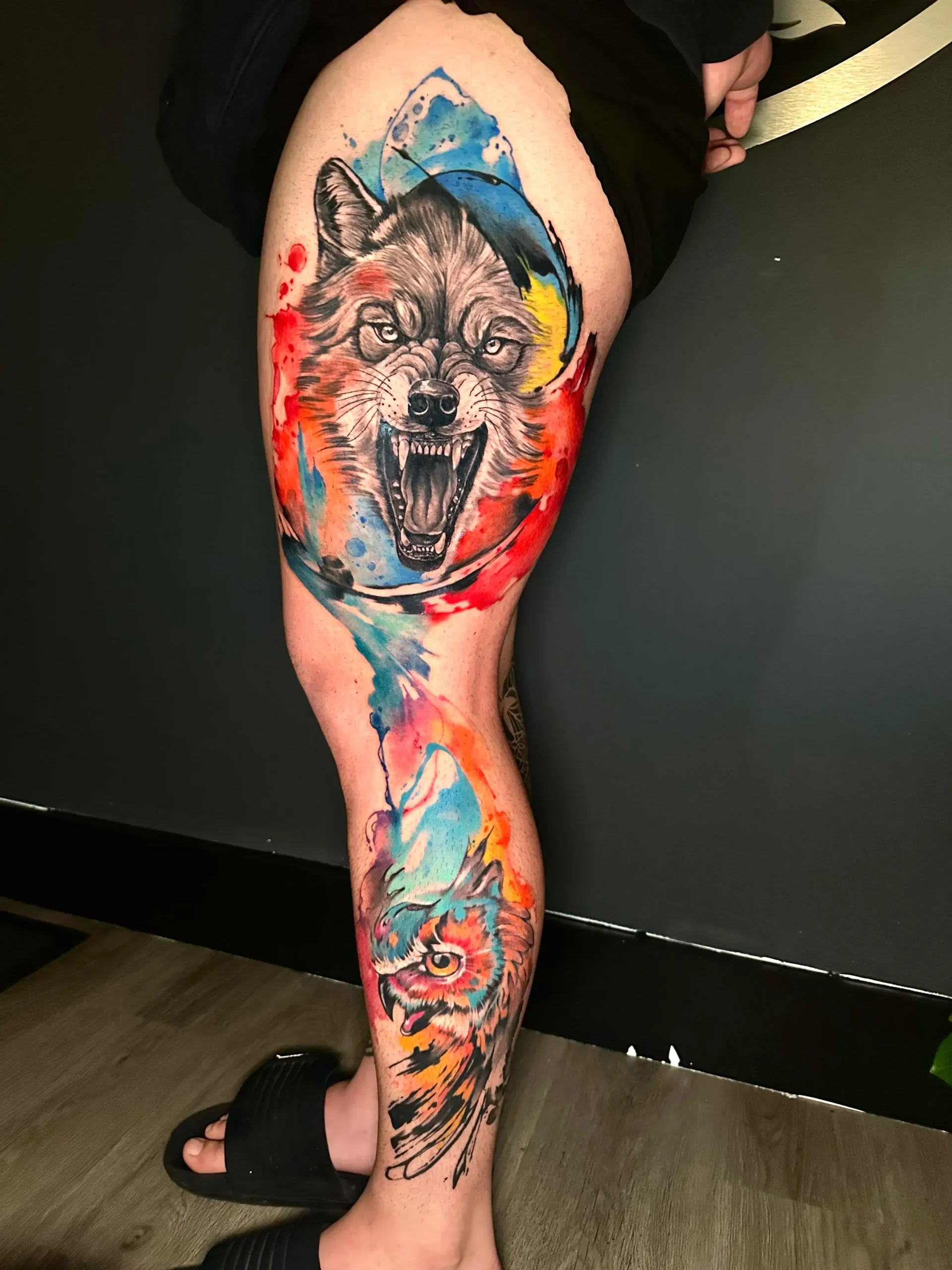 Custom watercolor wolf and owl leg sleeve tattoo vibrant animal ink South Florida Boca Raton